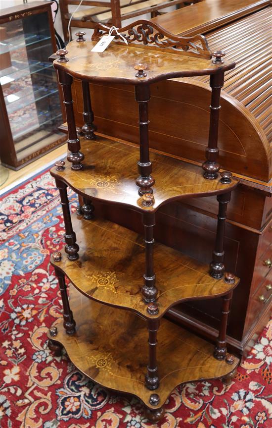 A Victorian inlaid burr walnut four-tier whatnot of serpentine form H.116cm